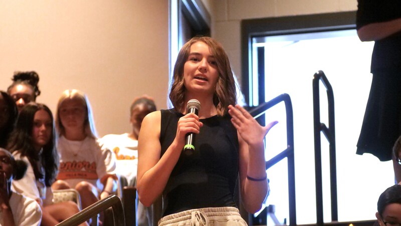 a villa rica senior speaks into a microphone