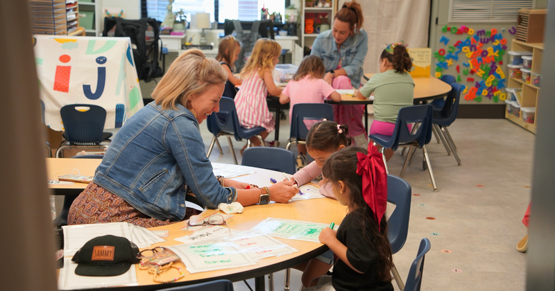 children and teachers in a classroom