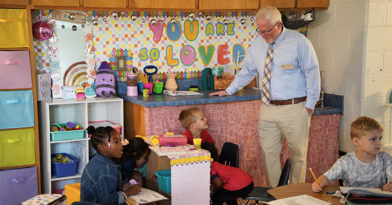 VRHS principal Rob Alford watches as young students learn