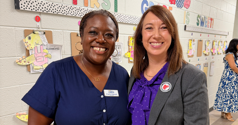 principal hopewell poses with superintendent ainsworth