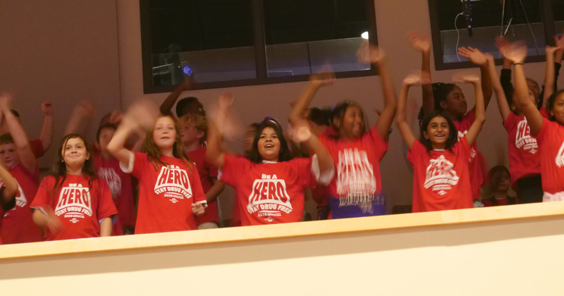students cheer at the drug rally