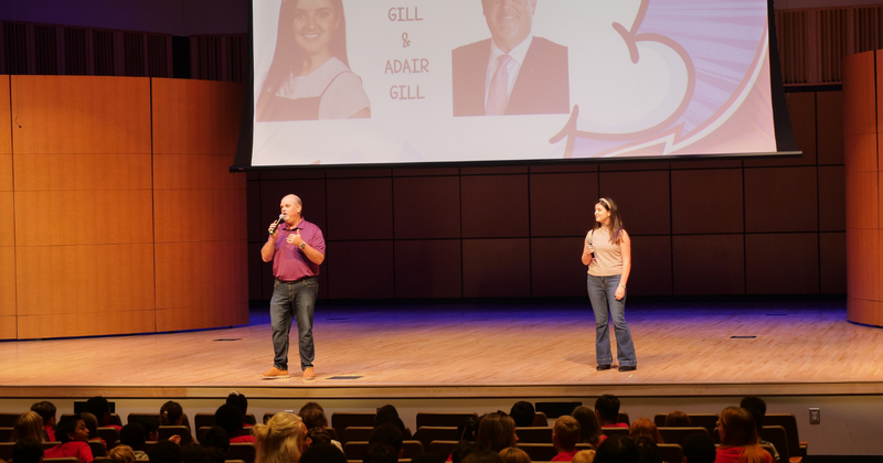 two people on a large stage