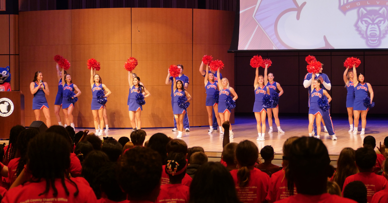 UWG cheerleaders lead a cheer on stage
