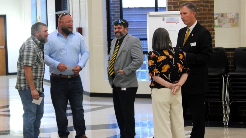 temple stakeholders gather in the cafeteria at temple middle school