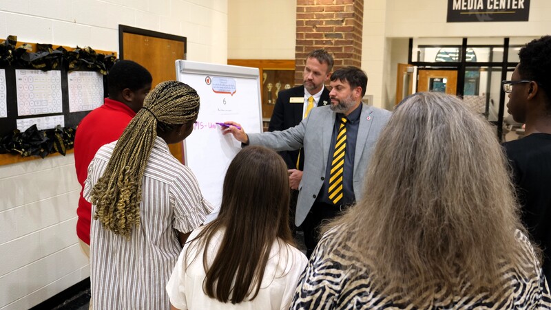 support services director tim gribben captures feedback from stakeholders on a large flip chart
