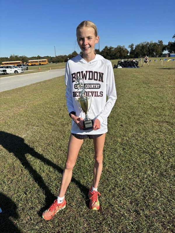 Bowdon High School junior runner Averi Lowen in the back to back to back girls cross country state champion