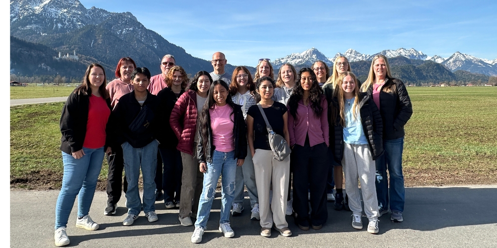 Students standing in front of The Alps