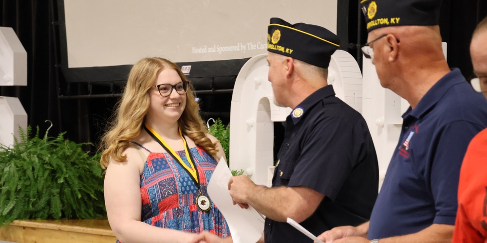student accepting scholarship