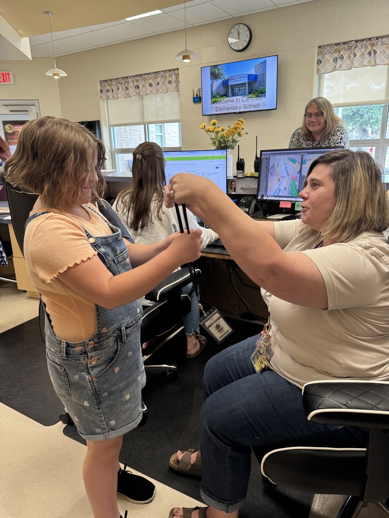 student putting on lanyard