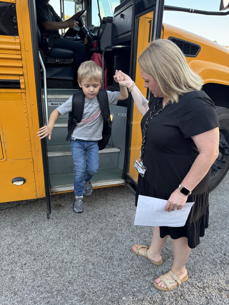 student getting off bus