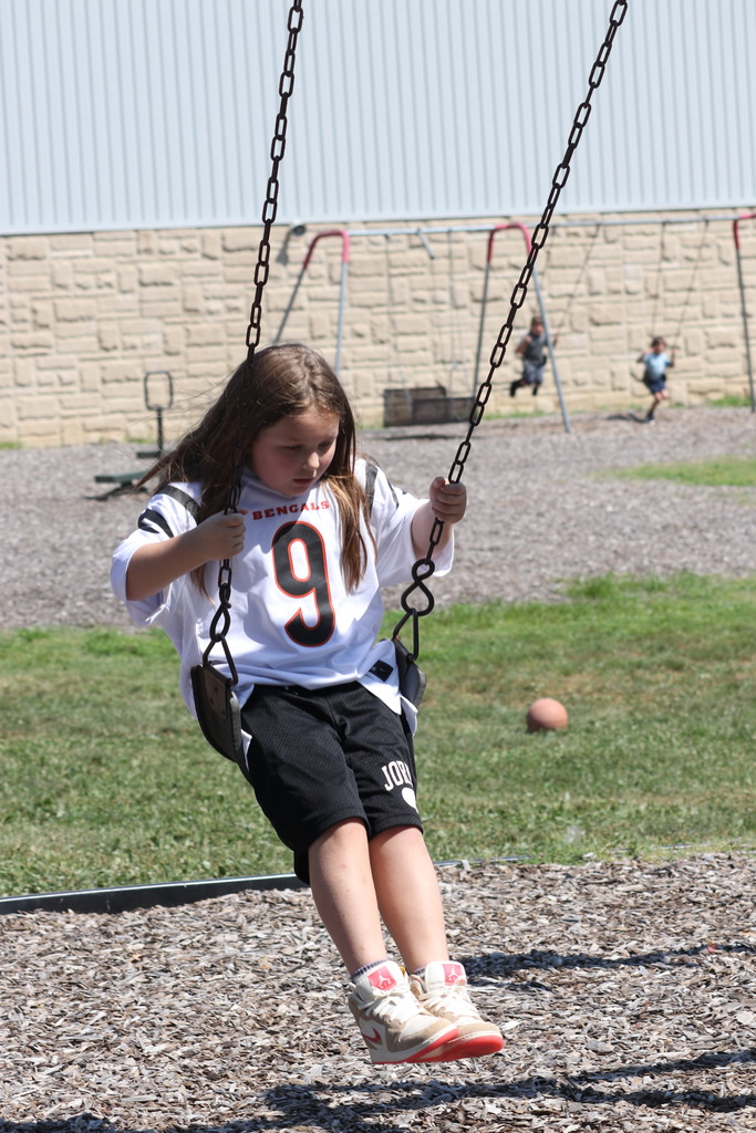 girl on swings