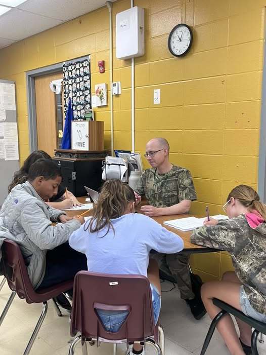 Mr. Roberts wearing a camoflauge T-Shirt.