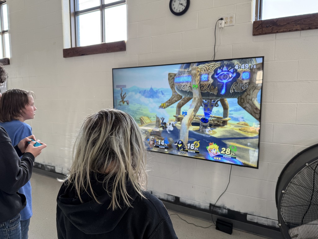 Students compete in a Super Smash Bros. tournoment.