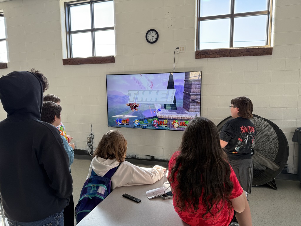 Students compete in a Super Smash Bros. tournoment.