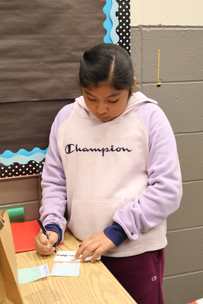 student writing card