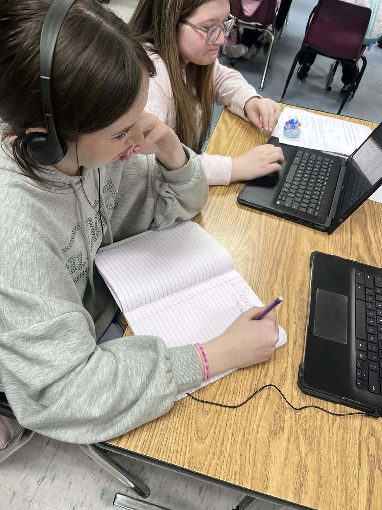Ms. Satchwell helping in Ms. Meffords class