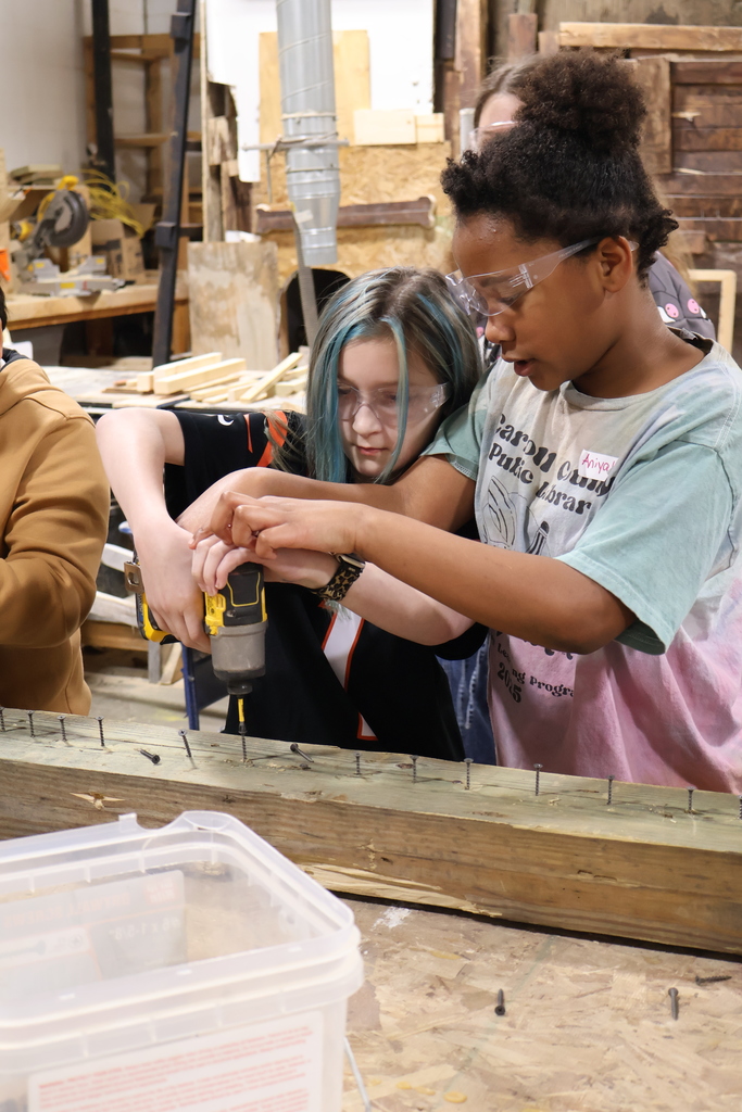 students using a drill