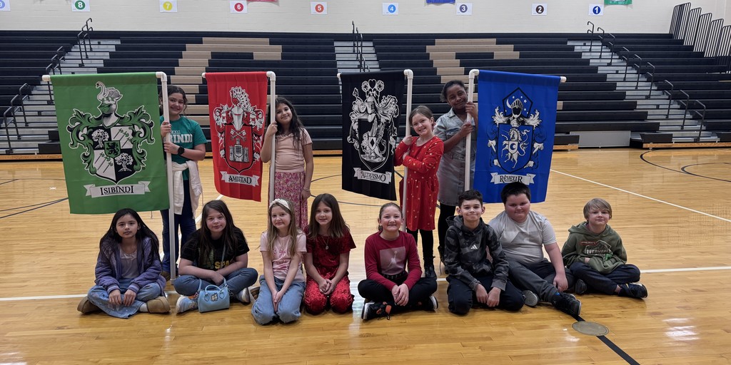 students holding house flags