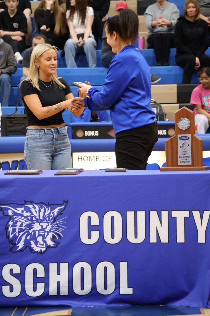 Basketball player receiving award
