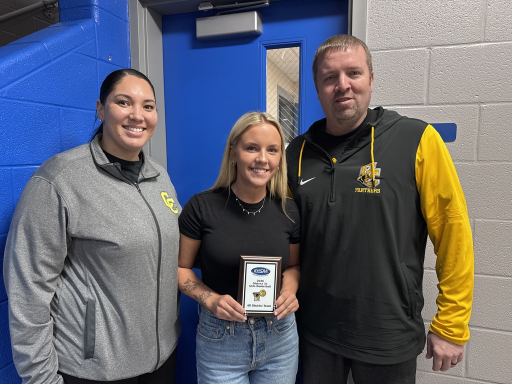 Basketball player with coaches