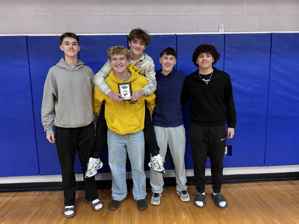 Basketball player with award and teammates