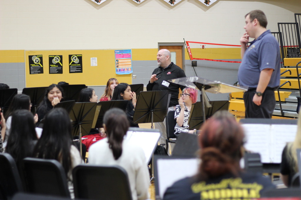 Dr. Christopher Schmidt working with the seventh grade band.