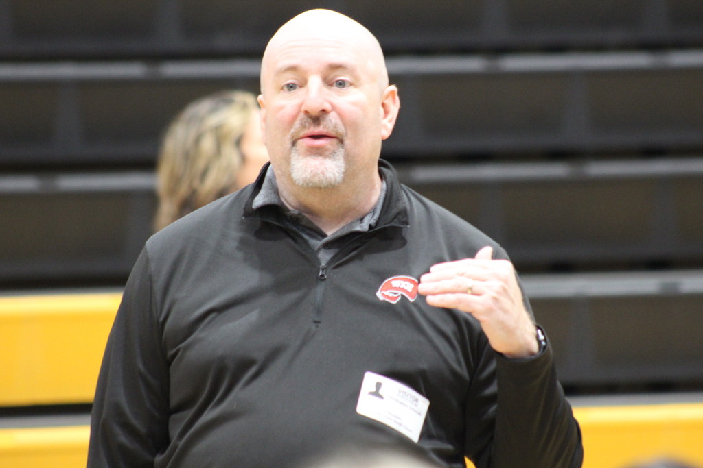 Dr. Christopher Schmidt working with the seventh grade band.