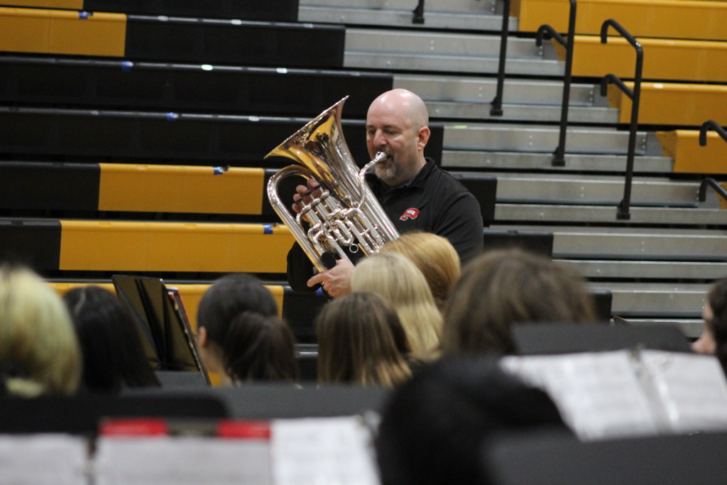 Dr. Christopher Schmidt working with the seventh grade band.
