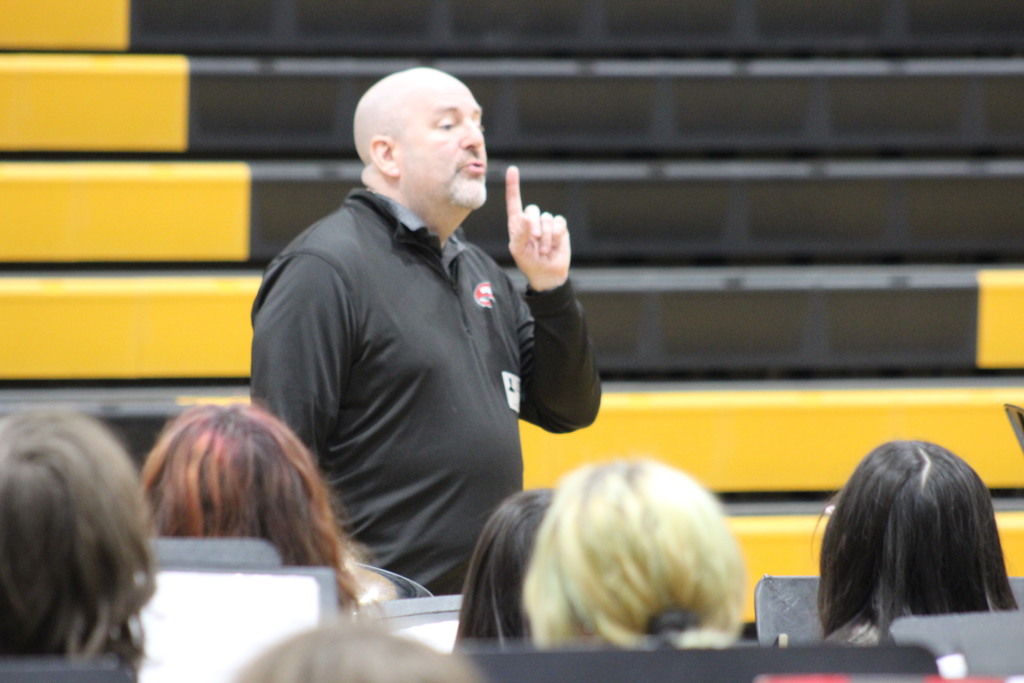 Dr. Christopher Schmidt working with the seventh grade band.