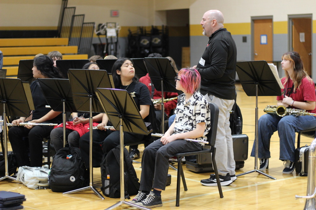 Dr. Christopher Schmidt working with the seventh grade band.
