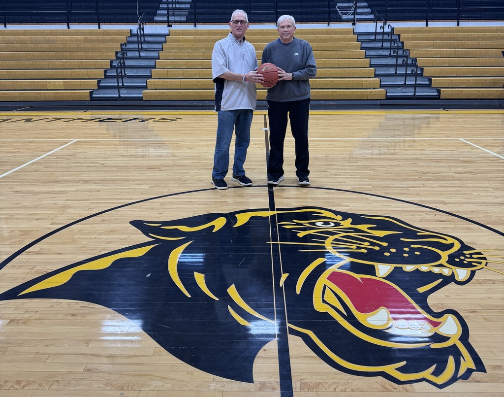 Two men being inducted into the hall of fame