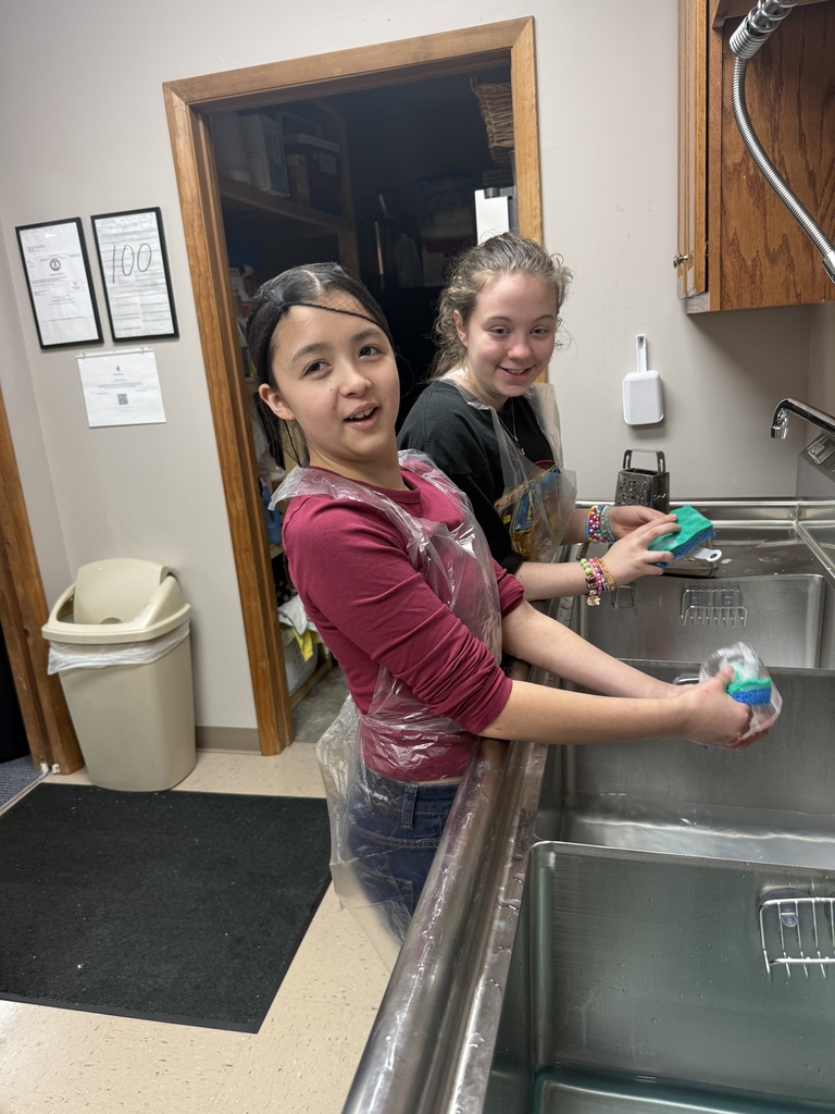 students washing dishes