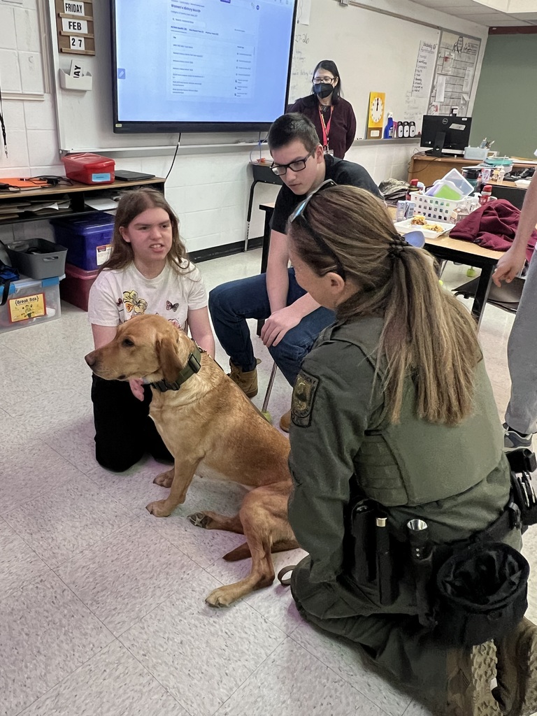 students petting K9 officer