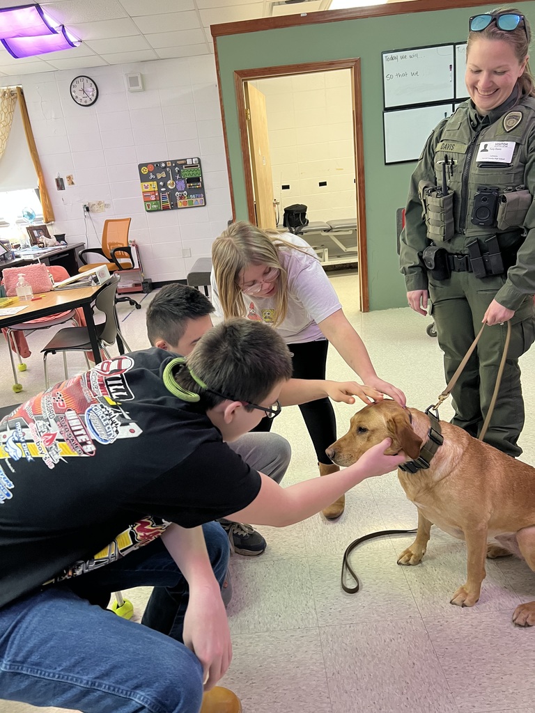 students petting K9 officer
