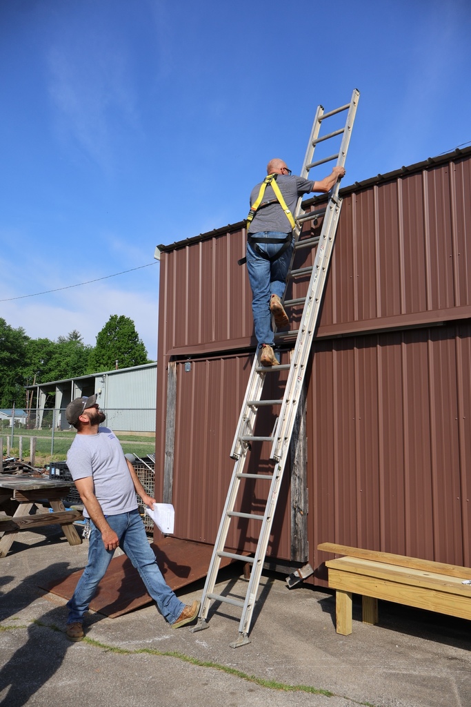 counselor climbing ladder