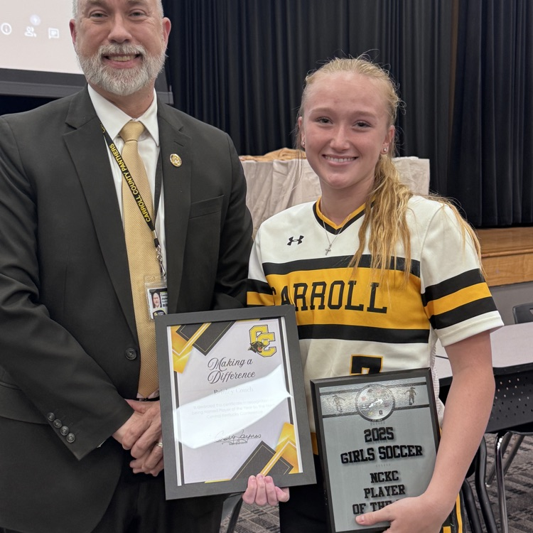 student getting award from superintendent