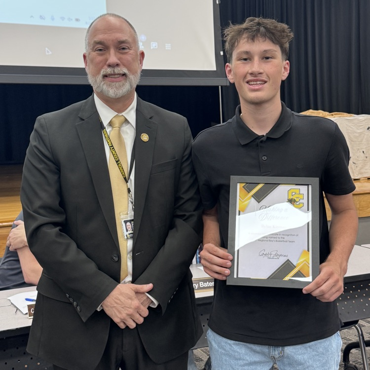 student getting award from superintendent