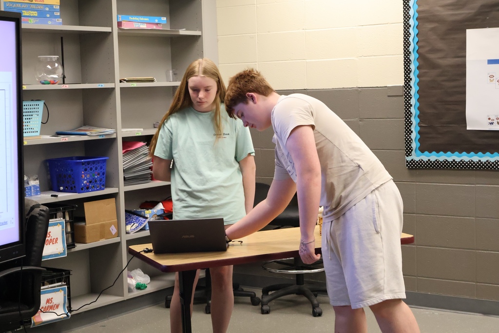 students helping one another