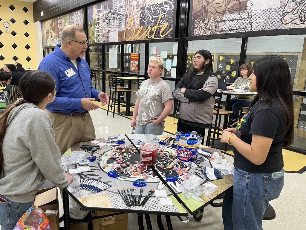 Banker speaking to students