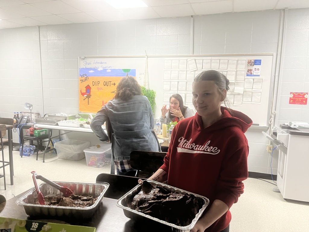 Student serving food for Staff Appreciation Week