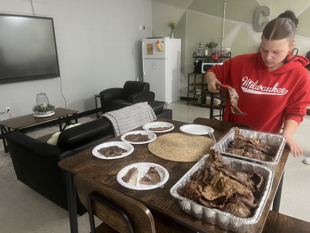 Student serving food for Staff Appreciation Week