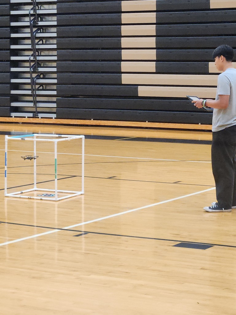 student flyinbg a drone