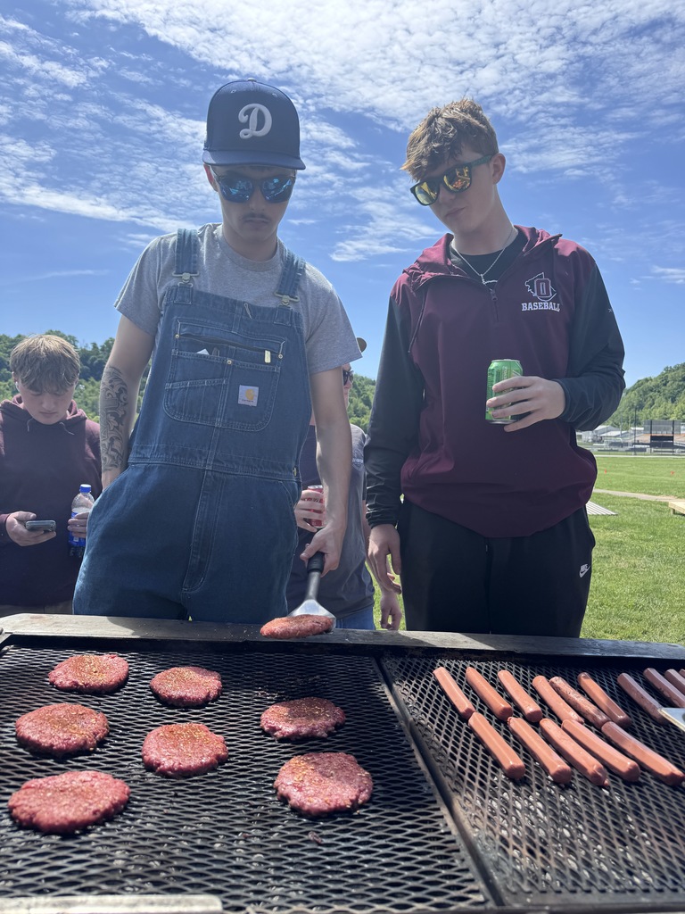 grilling hamburgers and hot dogs