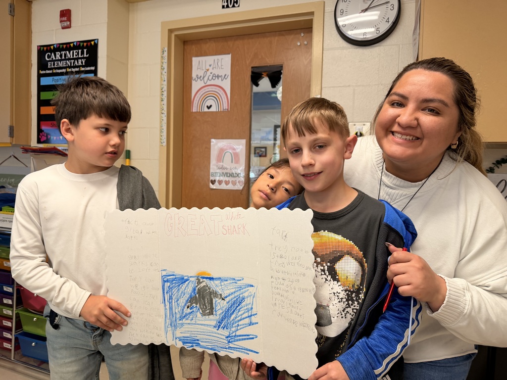 students posing for photo with teacher