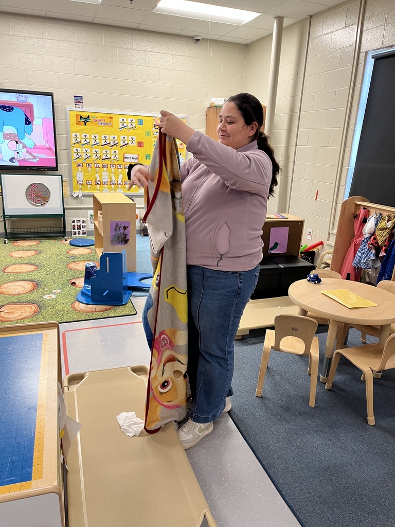 student cleaning classroom
