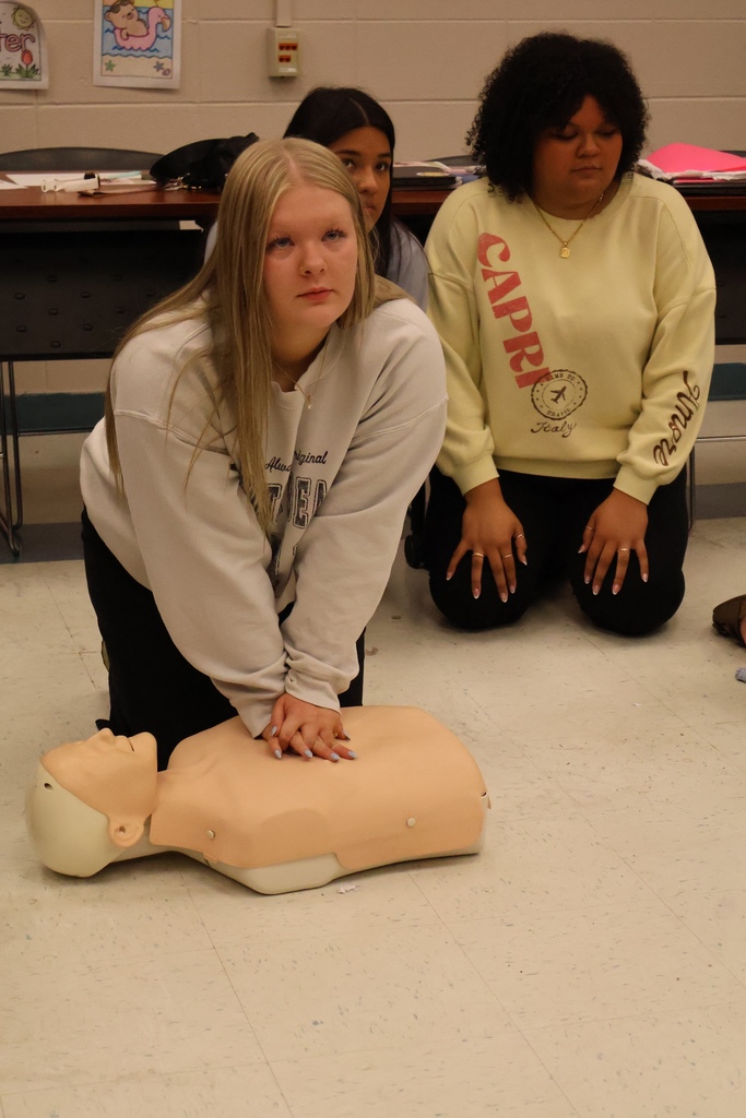 Students learning CPR