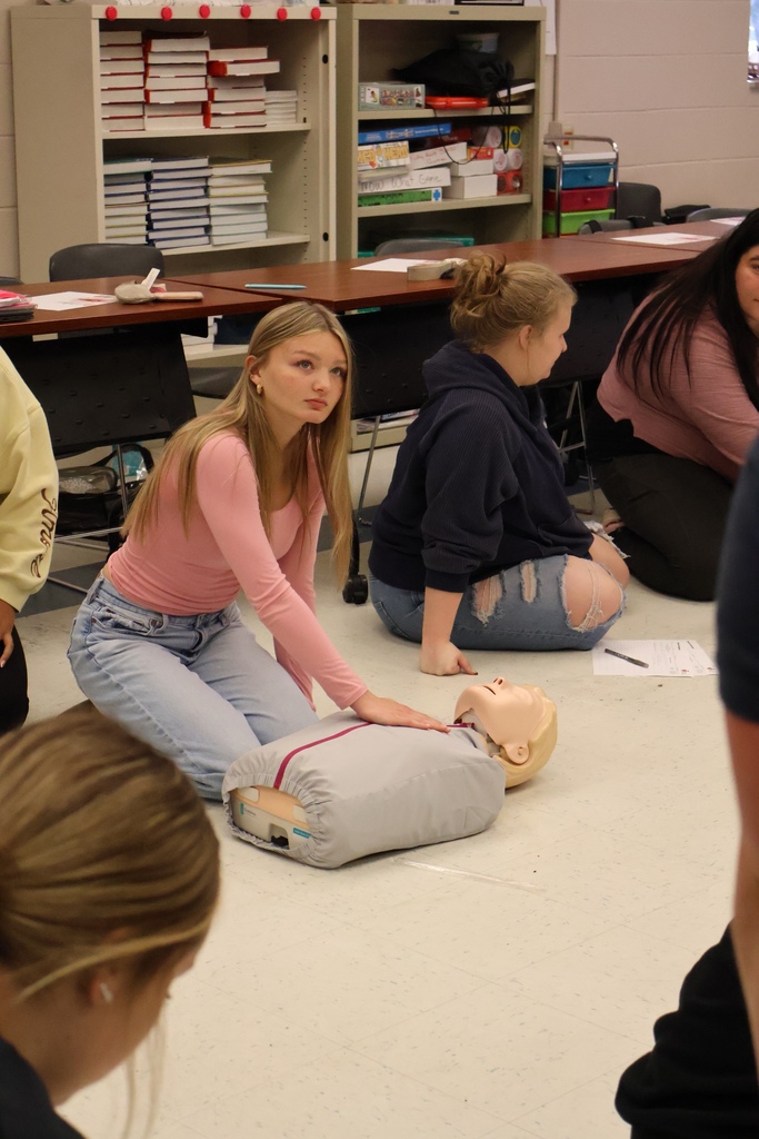Students learning CPR