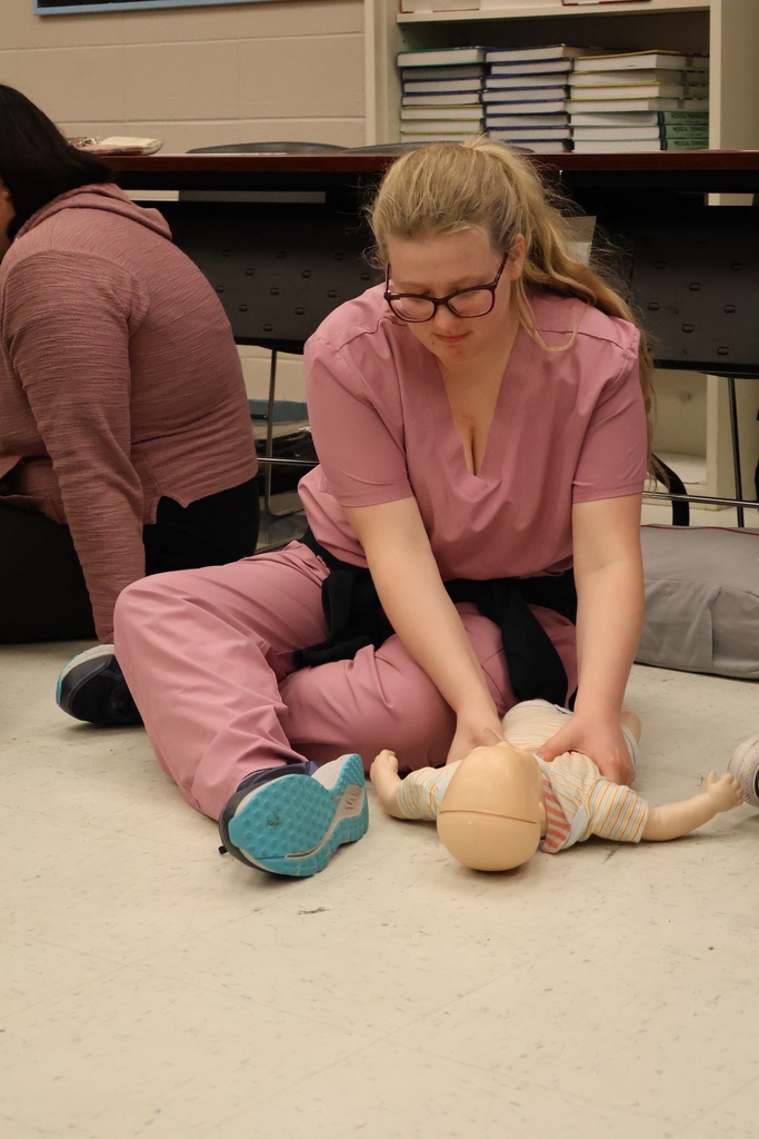 Students learning CPR