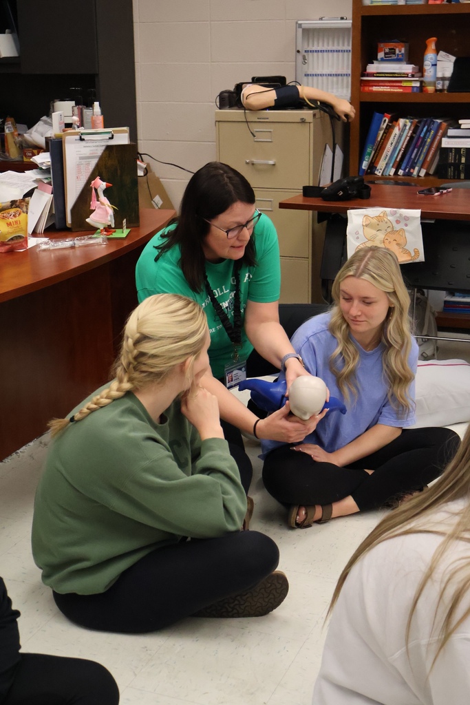 Students learning CPR