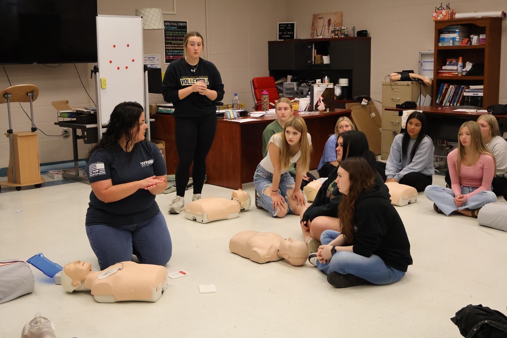 Students learning CPR